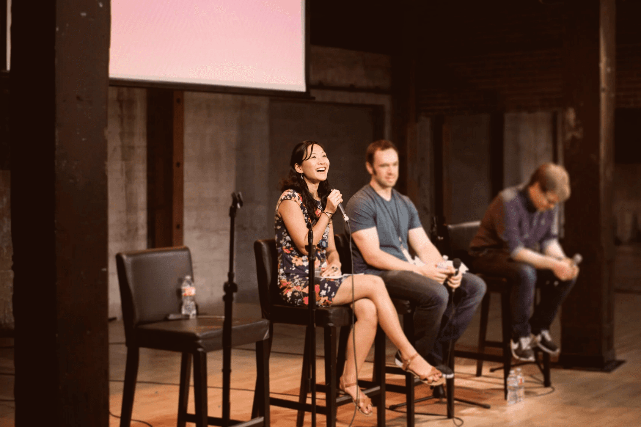 Tishia Que speaking on a panel